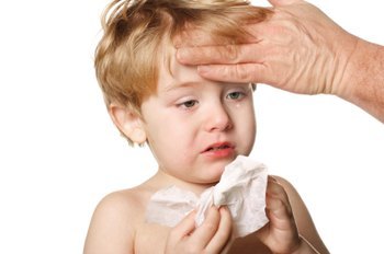 Sick Child Wiping His Nose Otherwise, Drinking Lots Of Fluids And Resting At Home Are The Recommended Treatment. If Your Child Develops A Secondary Infection, Your Doctor May Prescribe Antibiotics To Counteract Opportunistic Bacteria.
