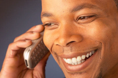 Smiling Man Talking On Cell Phone 1