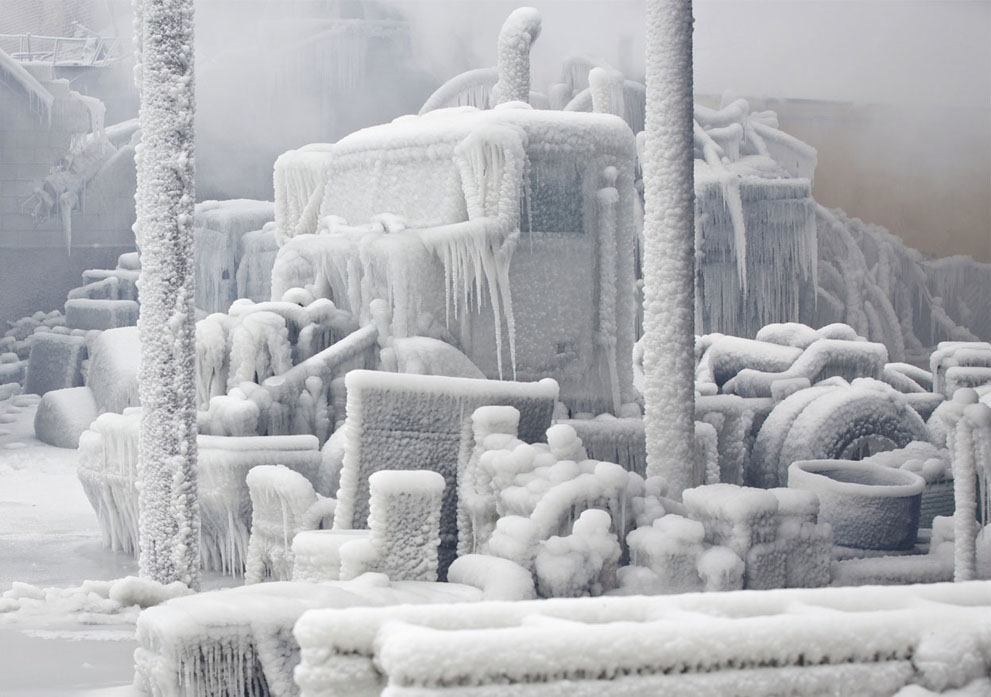 Fire And Ice Combined - An Ice-Encrusted Truck Is Blanketed In Smoke After A Warehouse Fire In Chicago, On January 23, 2013.