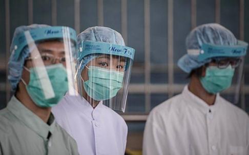 Officials Are Seen At The Border With Mainland China In Hong Kong On Thursday As Authorities Step Up Measures Against The Spread Of H7N9 Bird Flu. Photo: Afp