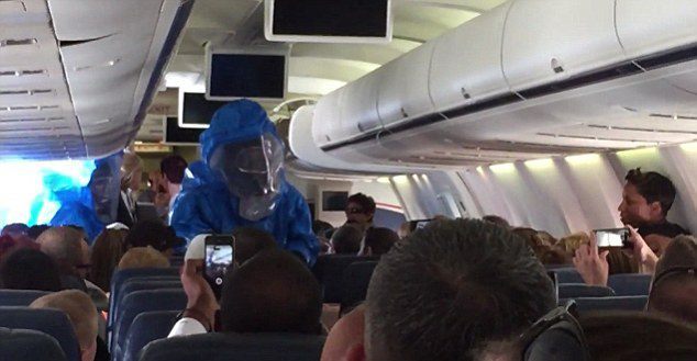 Image Of A Haz Mat Team Entering A Plane After A Man Who Had Been Coughing And Sneezing Screamed  &Quot;I Have Ebola.&Quot; He Tested Negative.