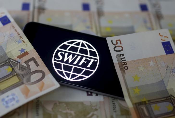 Swift Code Bank Logo Is Displayed On An Iphone 6S On Top Of Euro Banknotes In This Picture Illustration, January 26, 2016. Reuters/Dado Ruvic/Illustration/File Photo